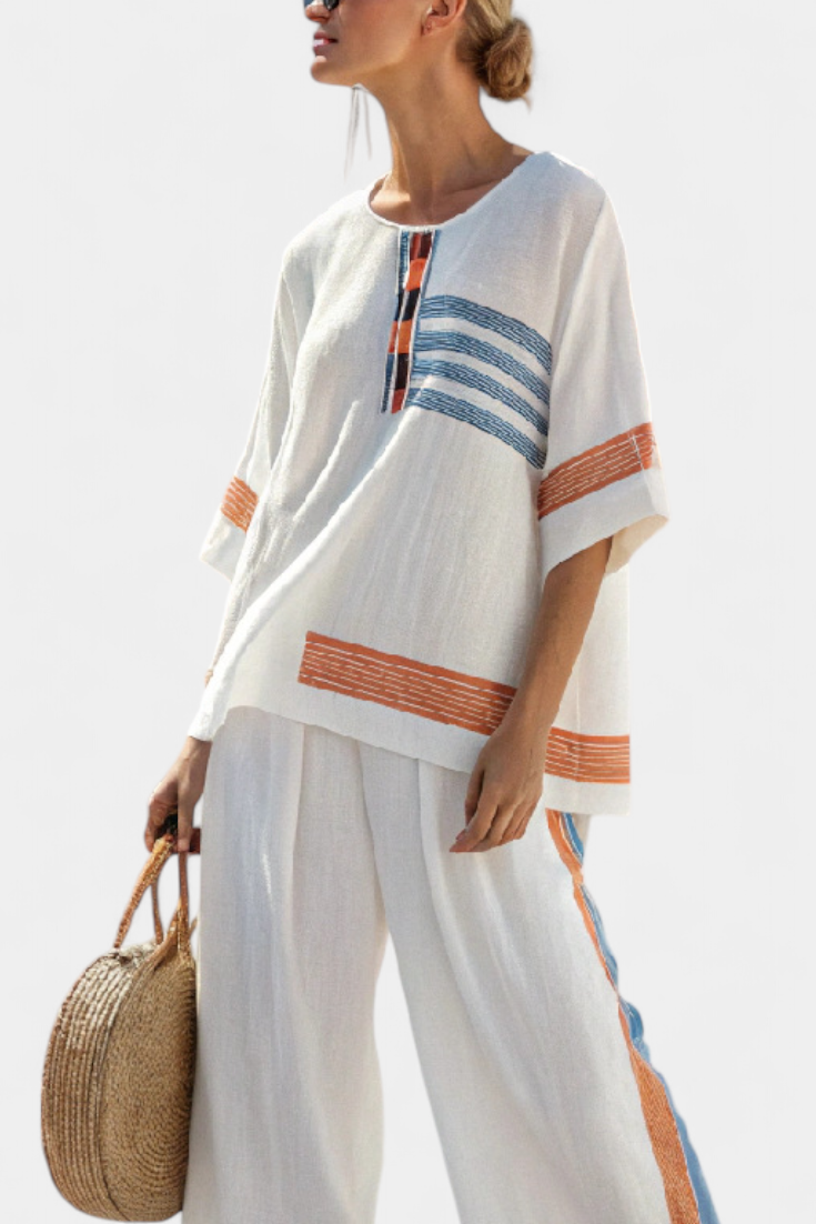 White Daisy ethnic sets with blue and orange details – unique and vibrant style