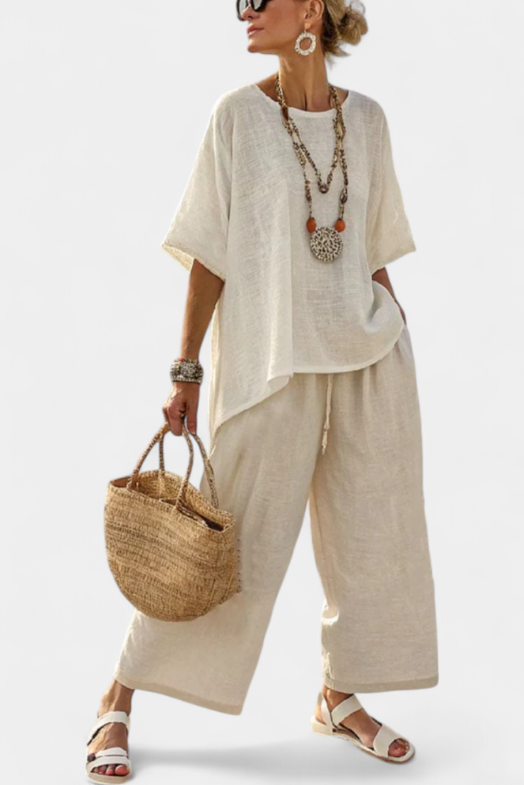 Completely minimalist Daisy in natural shades, with a ruffle blouse and wide-leg trousers for a simple and elegant style.