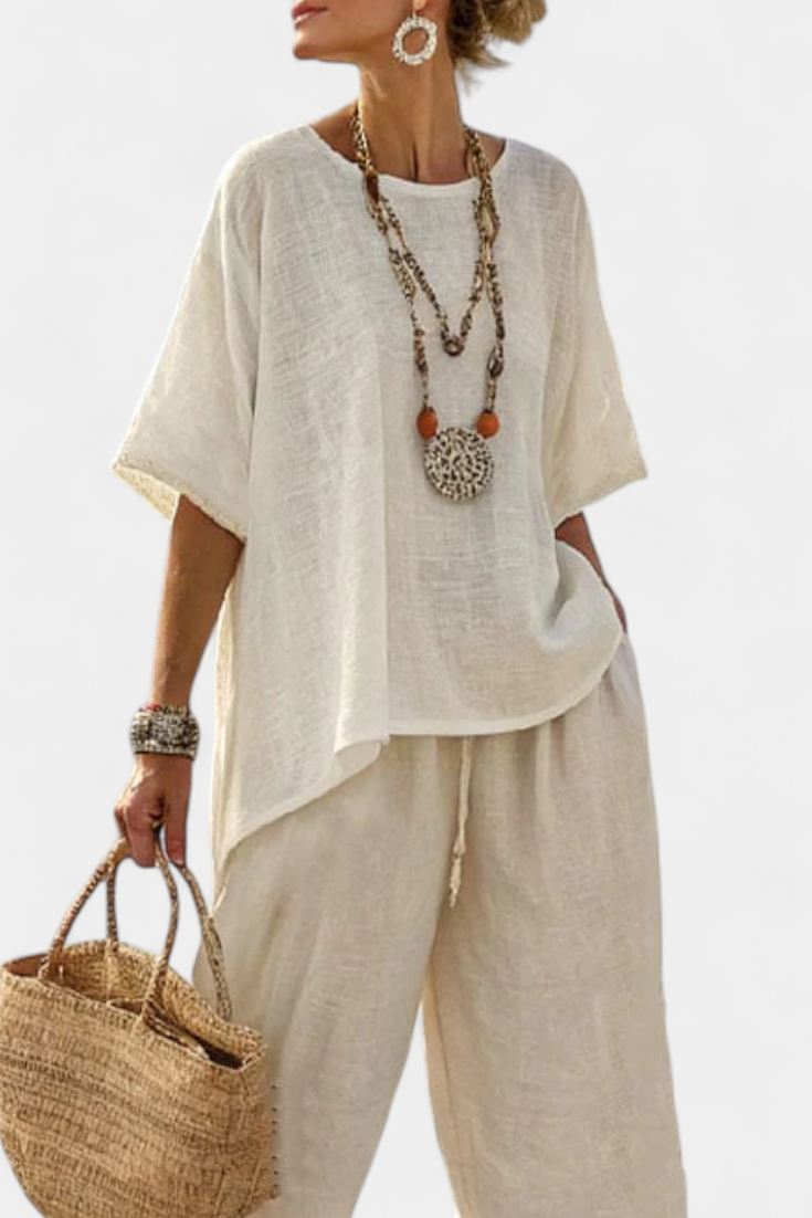 Completely minimalist Daisy in natural shades, with a ruffle blouse and wide-leg trousers for a simple and elegant style.